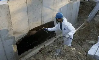 Professional waterproofing the exterior walls of the basement in Shreveport, LA