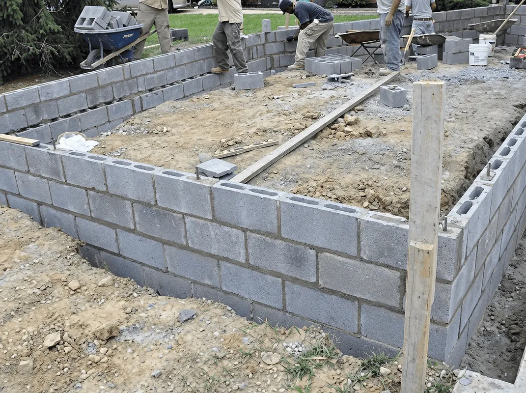 Professionals building a foundation with blocks in Shreveport, LA