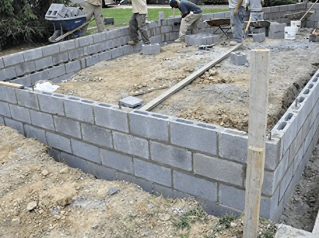 Professionals building a foundation with blocks in Shreveport, LA