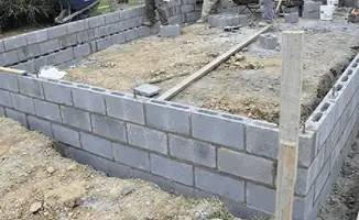 Professionals building a foundation with blocks in Shreveport, LA